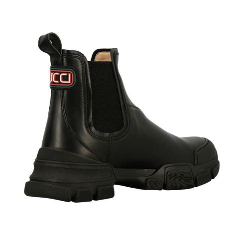 Nuova collezione di stivali da uomo di Gucci su FARFETCH.